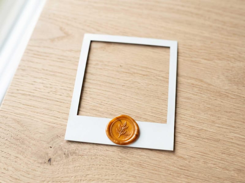 Polaroid frame with an amber wax seal, a reviewed admin example marker.